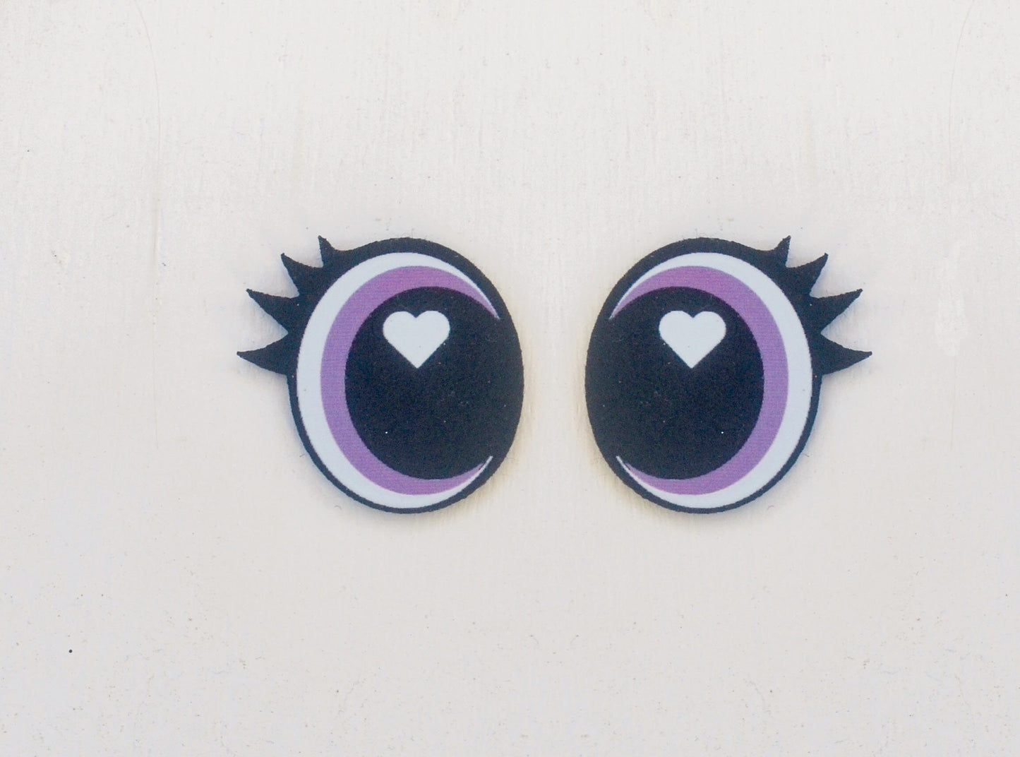 a pair of eyes with a heart in the center