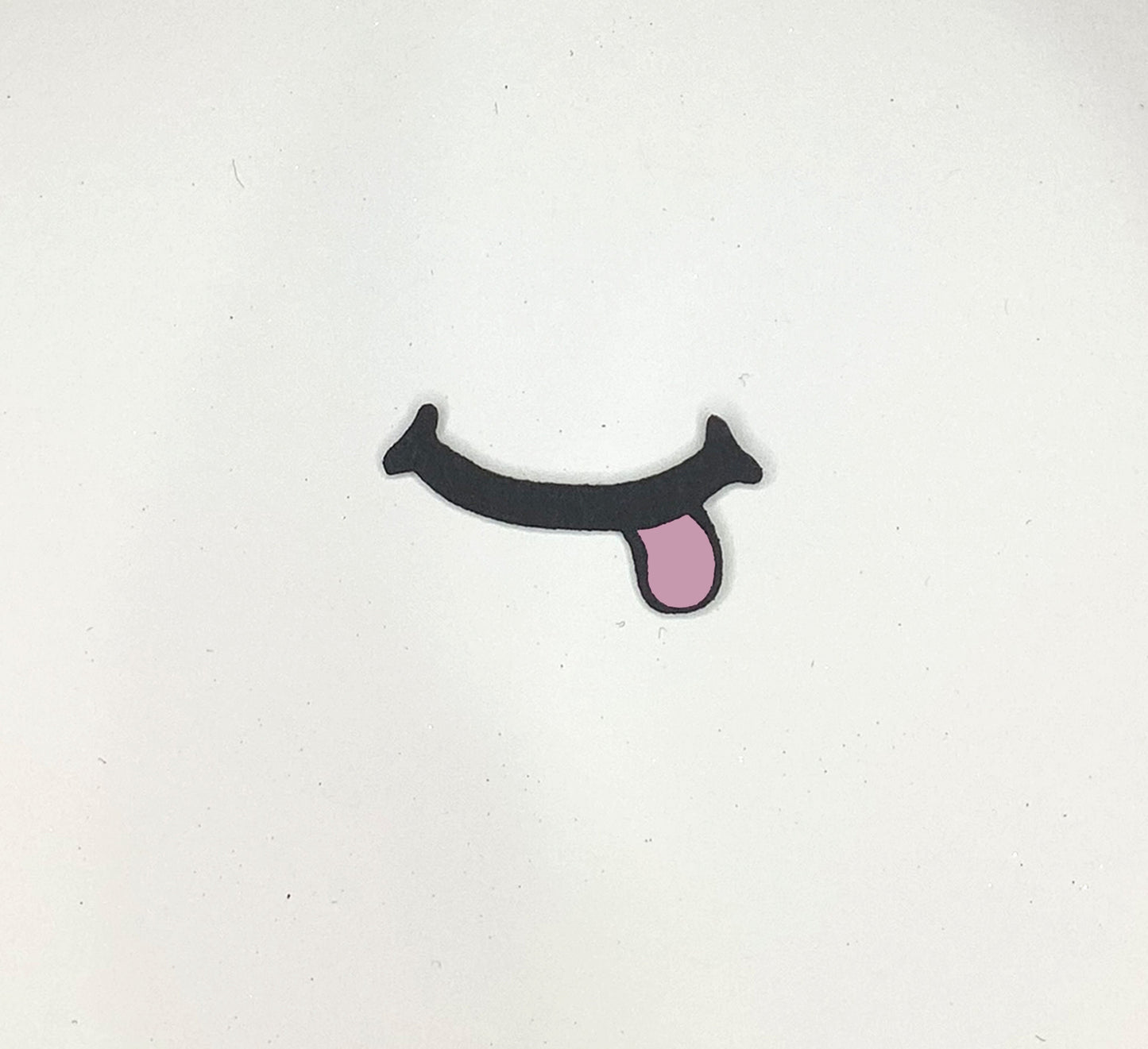 a sticker of a tongue sticking out of the side of a wall