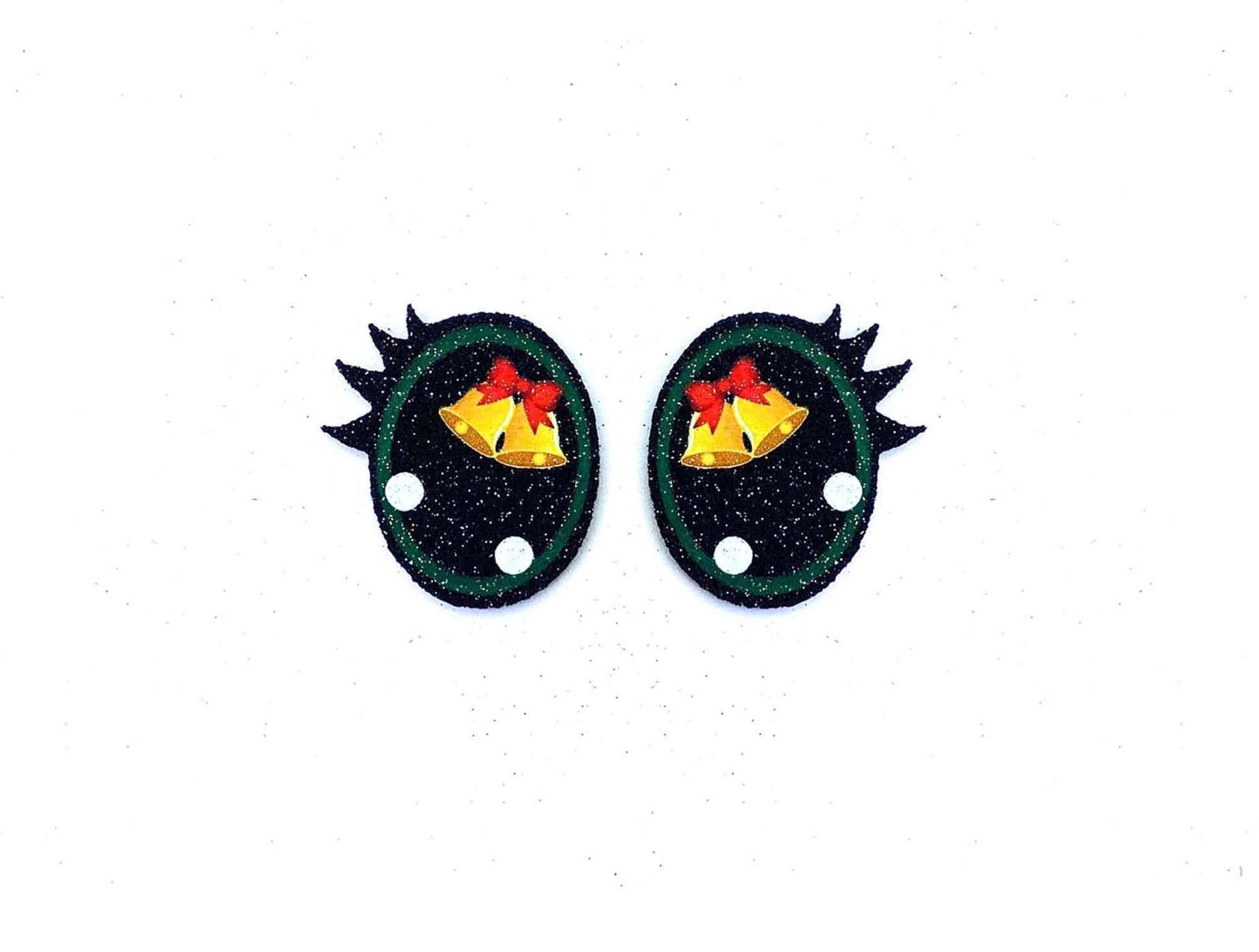 a pair of black and green earrings with gold bells