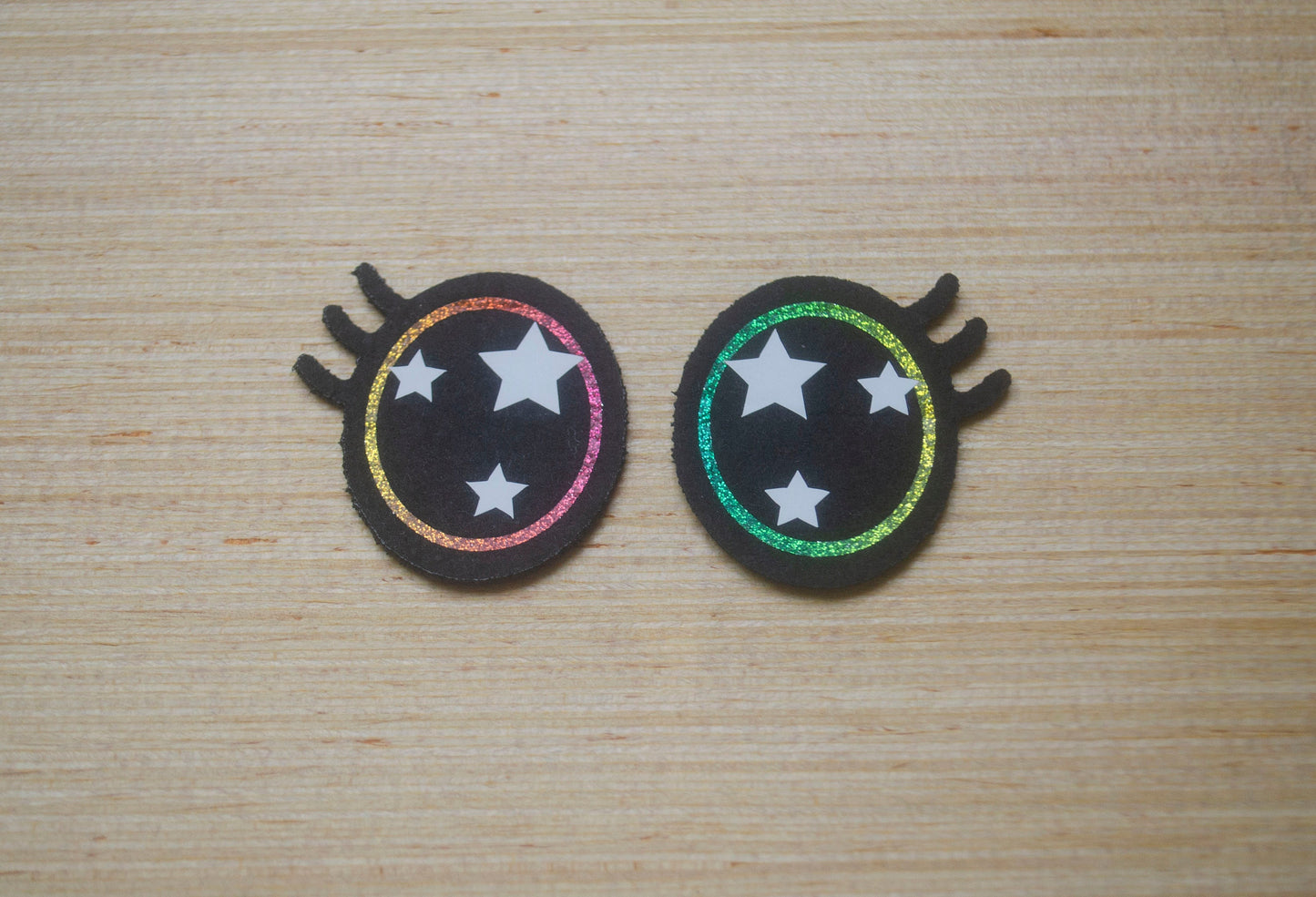 a pair of hair clips with stars on them