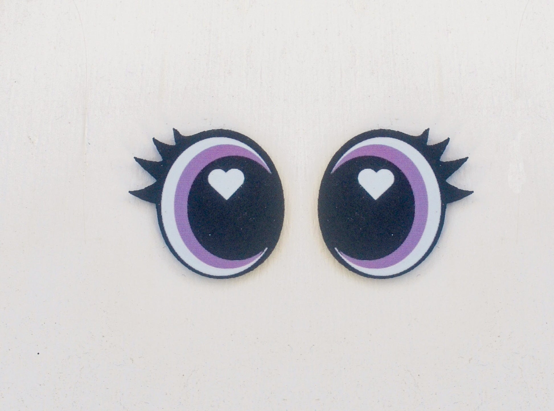 a pair of eyes with a heart in the center