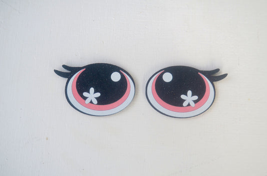 a pair of black and pink eyes with black wings