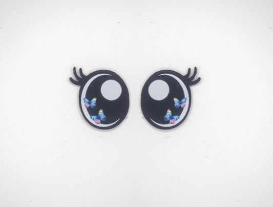 a pair of black and white eyes with blue flowers