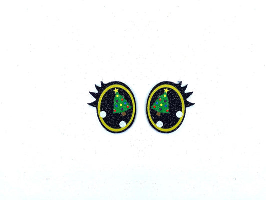a pair of black and yellow felt eyeswith a christmas tree on it