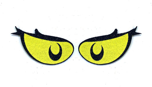 a pair of yellow eyes with black eyelashes