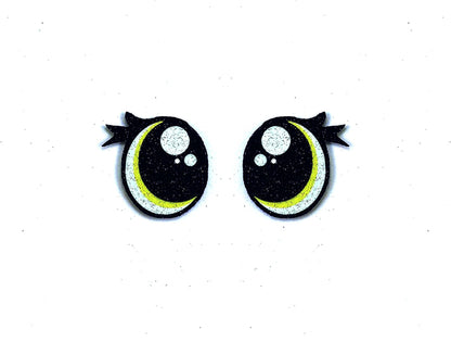 a pair of black and yellow eyes with black bows