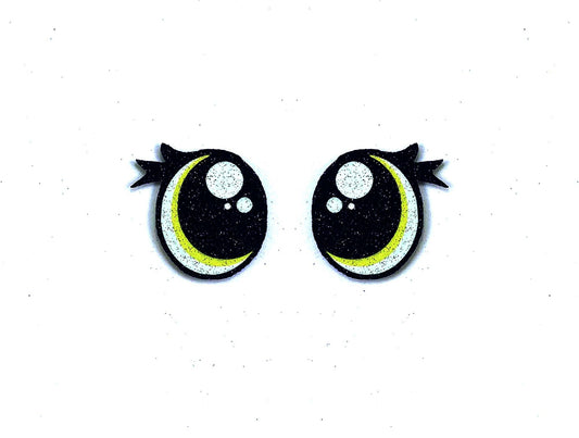 a pair of black and yellow eyes with black bows