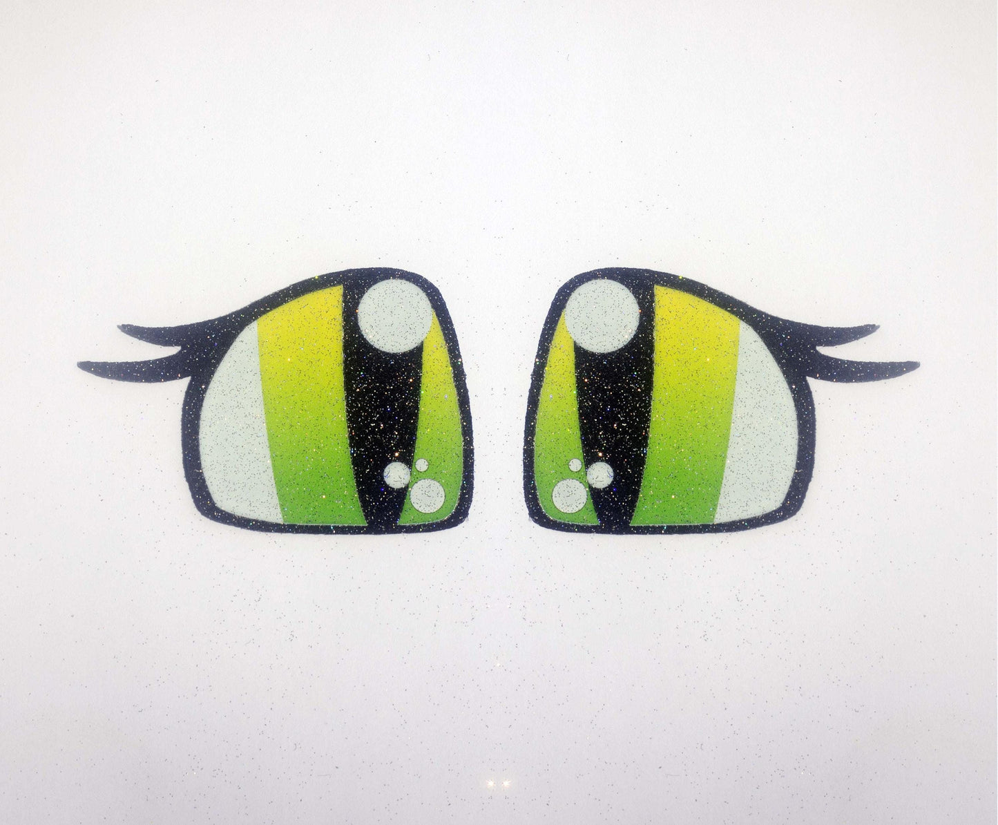 a pair of green eyes with black and white stripes