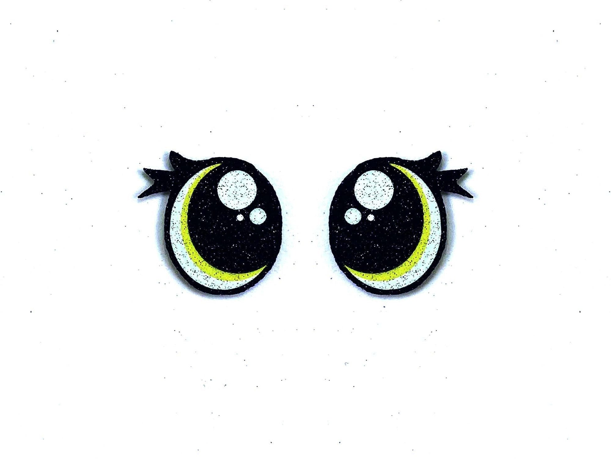 a pair of black and yellow eyes with black bows