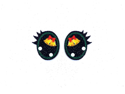 a pair of black and green earrings with gold bells